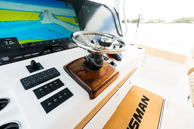Slide: The Image of Manufacturer Provided Image: 2026 Sportsman Open 402 Center Console helm with navigation display and controls. - 5