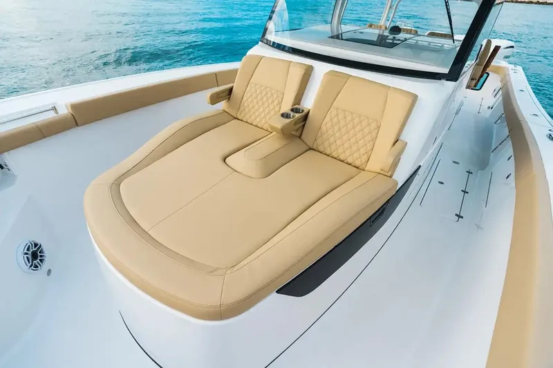 Slide: The Image of Manufacturer Provided Image: 2026 Sportsman Open 402 Center Console boat with luxurious tan seating on blue water. - 6