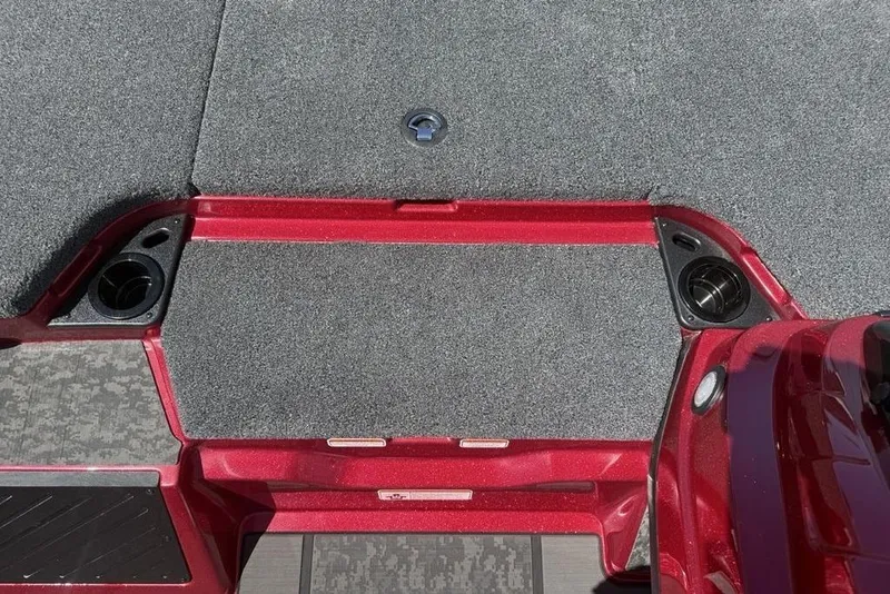 Slide: The Image of Interior of 2026 Nitro Z20 XL Pro boat with red accents and carpeted flooring. - 11