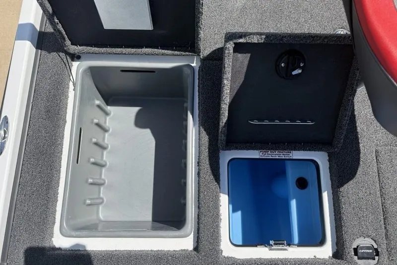 Slide: The Image of 2026 Nitro Z20 XL Pro boat storage compartments with pump-out feature and carpeted interior. - 12