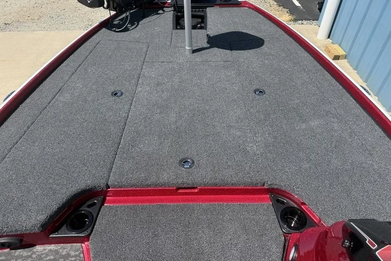 Slide: The Image of 2026 Nitro Z20 XL Pro boat deck with gray carpeting and red trim. - 16