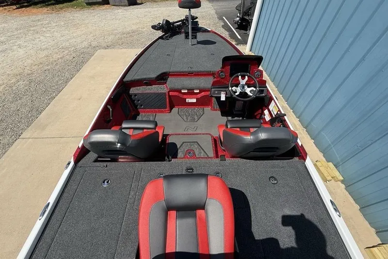 Slide: The Image of 2026 Nitro Z20 XL Pro boat interior with red and gray seating, steering console. - 24