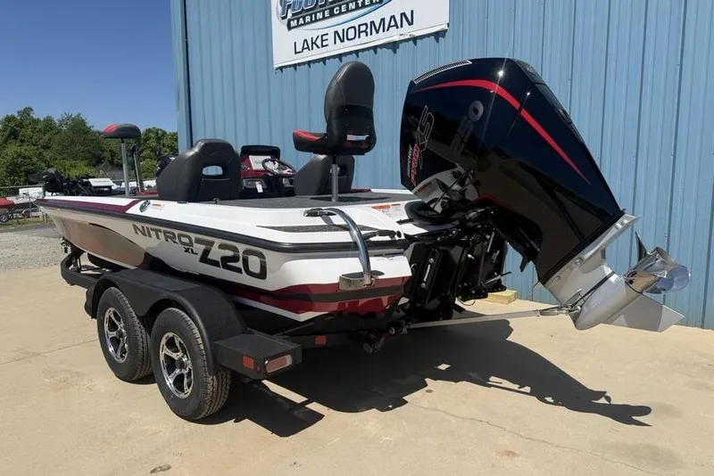 Slide: The Image of 2026 Nitro Z20 XL Pro boat with powerful outboard motor, parked at Lake Norman. - 7