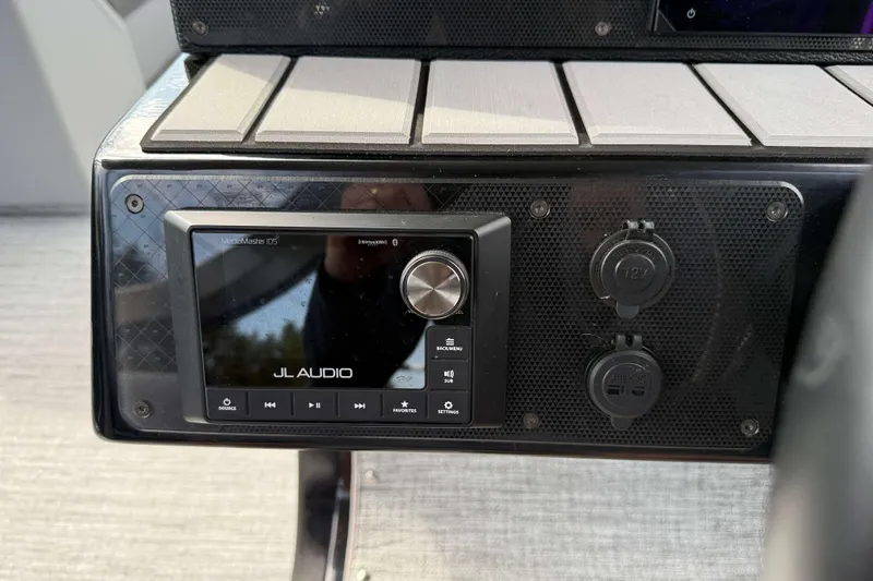 Slide: The Image of JL Audio system on 2025 Premier 250 Solaris Upper Deck - CL boat dashboard. - 12