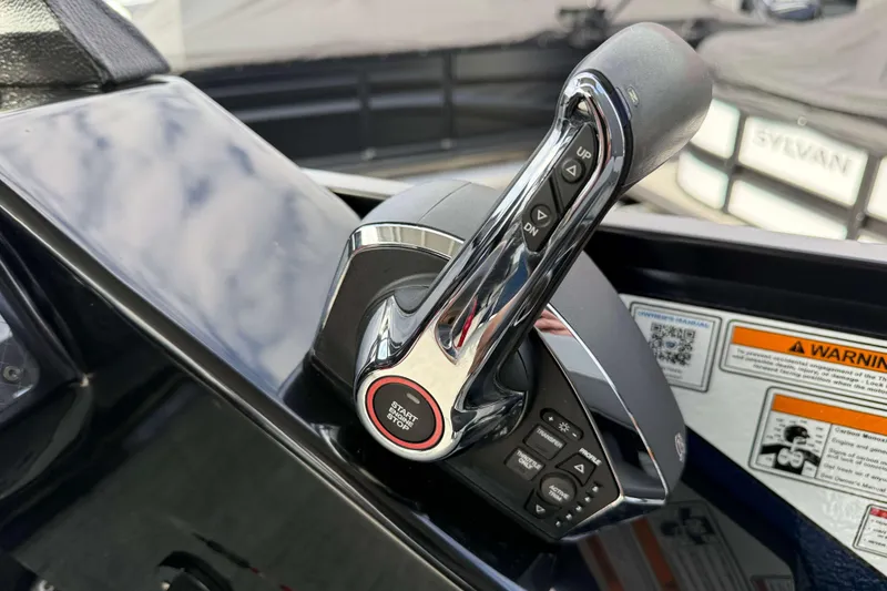 Slide: The Image of Premier 250 Solaris Upper Deck 2025 throttle control with start/stop button and warning labels. - 14