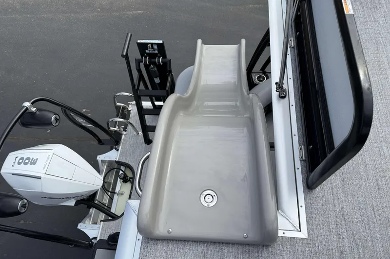 Slide: The Image of 2025 Premier 250 Solaris Upper Deck - CL boat with slide and outboard motor. - 23
