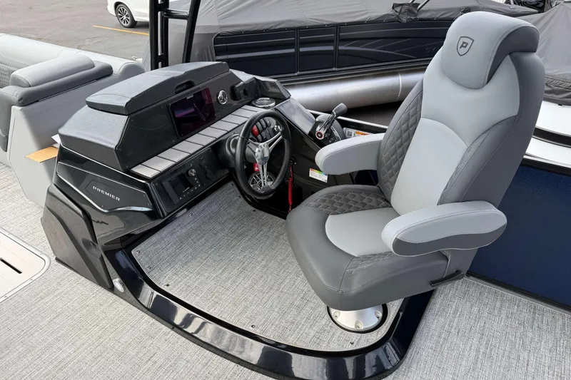 Slide: The Image of Captain's chair and helm of 2025 Premier 250 Solaris Upper Deck - CL boat. - 7