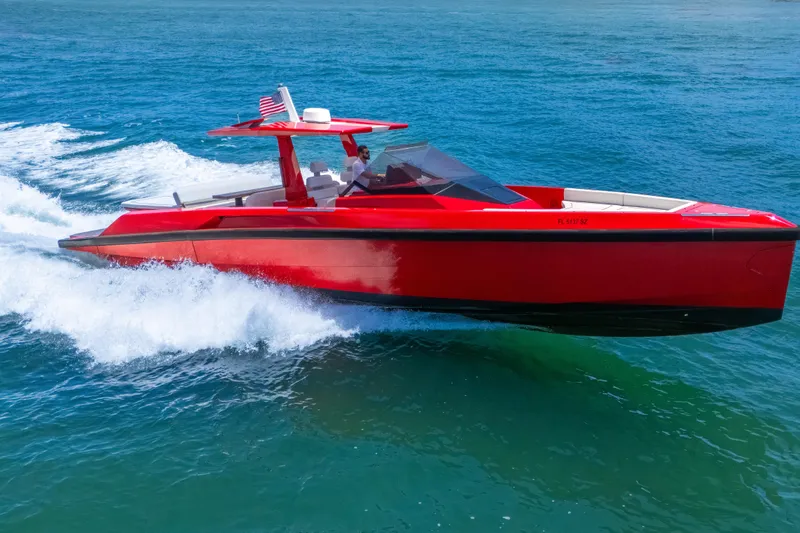 Slide: The Image of Red 2021 Wally 48 yacht cruising on blue ocean waters. - 10