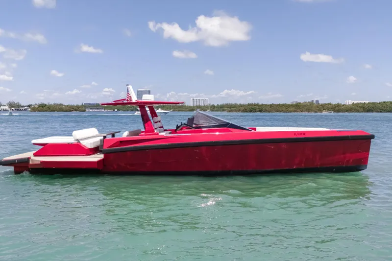 Slide: The Image of Red 2021 Wally 48 yacht on clear blue water under a sunny sky. - 14