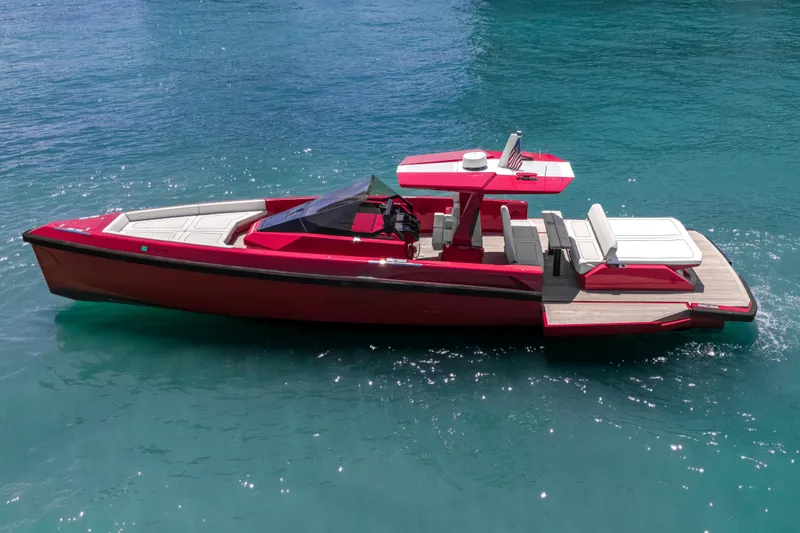 Slide: The Image of Red 2021 Wally 48 yacht on clear blue water, showcasing sleek design and luxury features. - 15