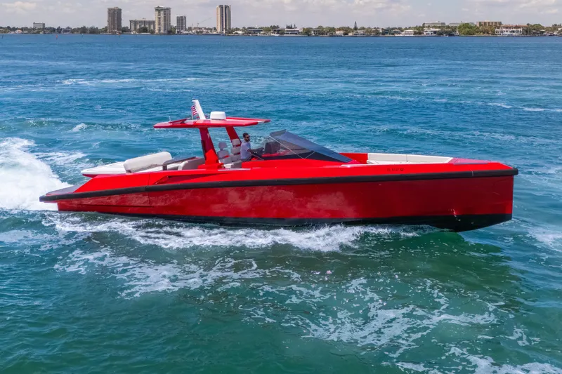 Slide: The Image of Red 2021 Wally 48 yacht cruising on blue ocean waters. - 17