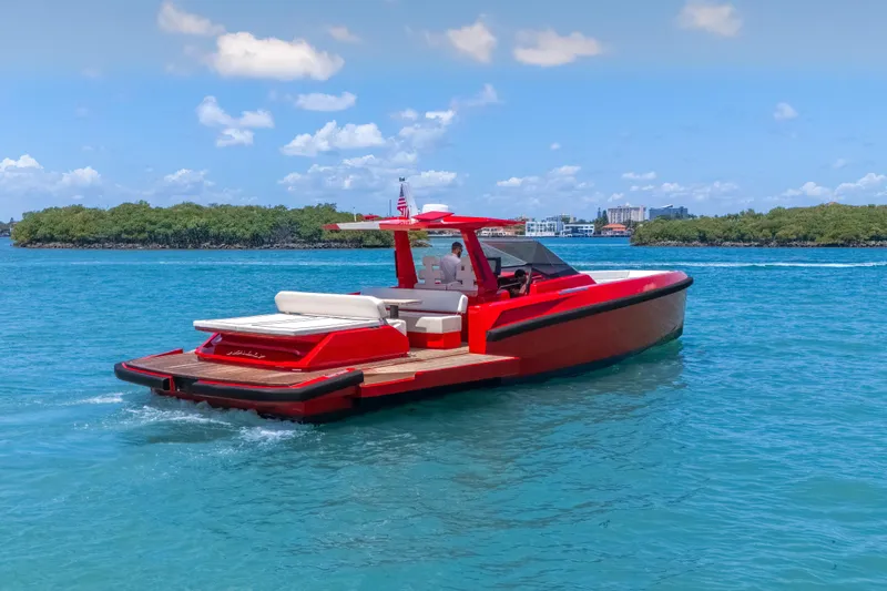 Slide: The Image of Red 2021 Wally 48 yacht cruising on blue water under a clear sky. - 18