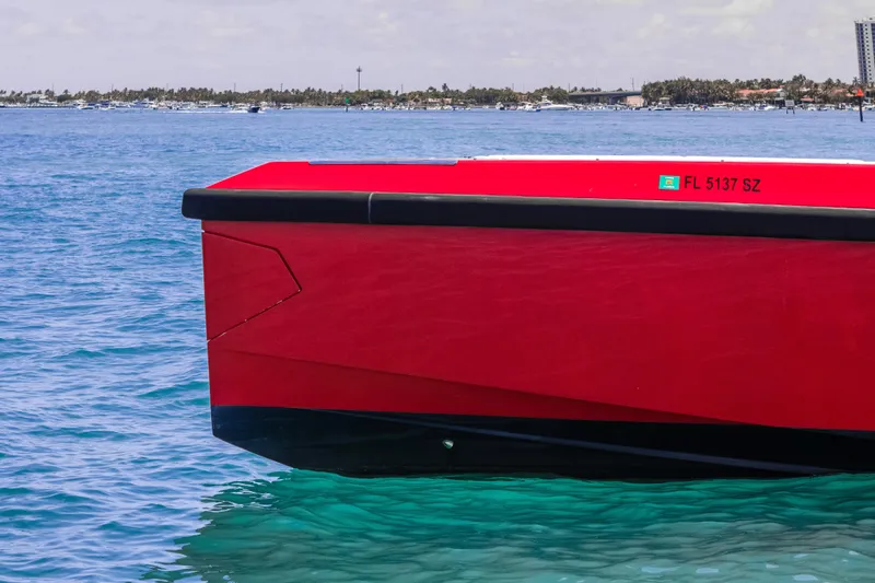 Slide: The Image of Red Wally 48 boat on clear blue water, 2021 model, side view. - 19
