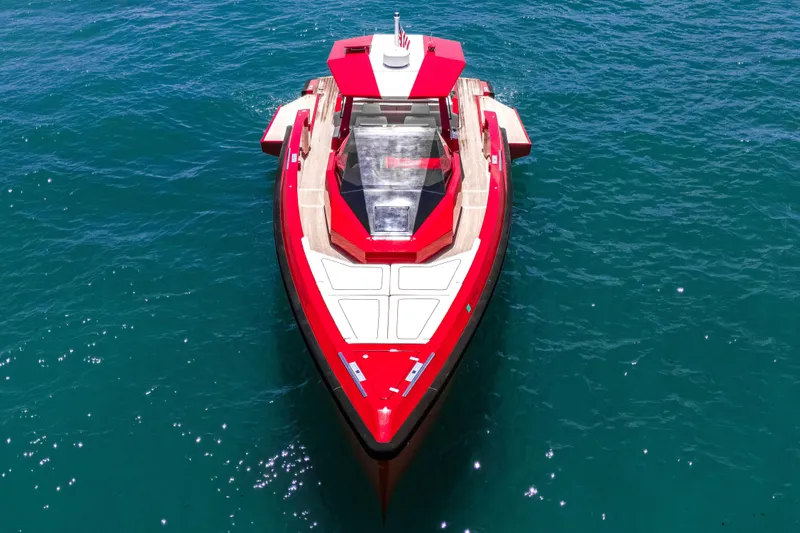 Slide: The Image of Red 2021 Wally 48 yacht on clear blue water, aerial view. - 20