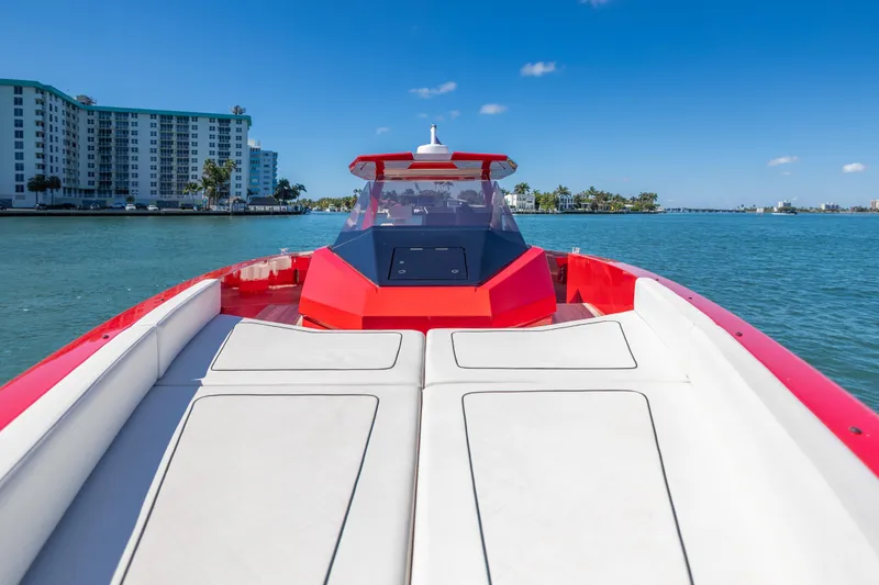Slide: The Image of 2021 Wally 48 boat cruising on a sunny day near waterfront buildings. - 25