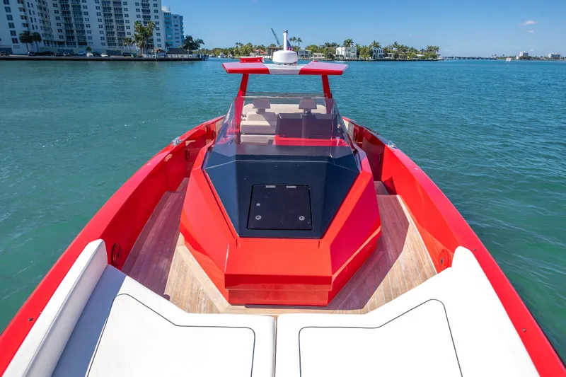 Slide: The Image of Red 2021 Wally 48 yacht on calm water, with modern design and cityscape background. - 26