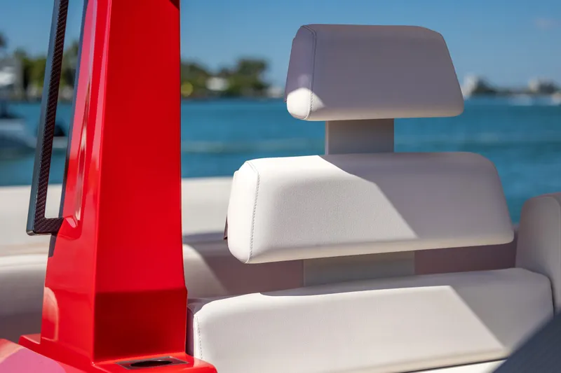 Slide: The Image of Red and white seating on a 2021 Wally 48 boat with ocean backdrop. - 34