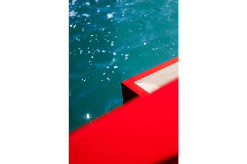 Slide: The Image of Red Wally 48 yacht detail against sparkling blue water, 2021 model. - 41