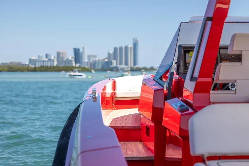 Slide: The Image of Red Wally 48 yacht interior with city skyline in the background, 2021 model. - 44