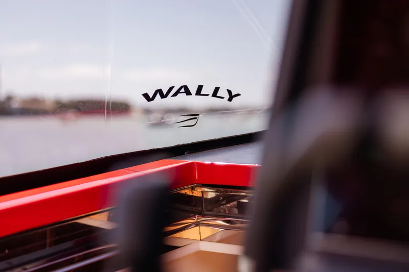 Slide: The Image of Wally 48 yacht interior with logo, 2021 model, featuring sleek design and red accents. - 46