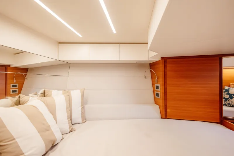 Slide: The Image of Luxurious interior of 2021 Wally 48 yacht cabin with modern design and cozy bedding. - 49