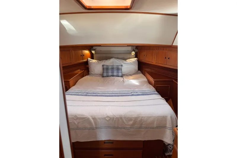Slide: The Image of Cozy cabin interior of 1999 Grand Banks 38 Eastbay EX with wooden cabinetry. - 28