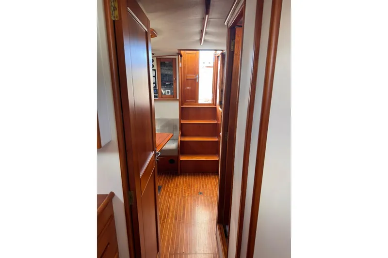 Slide: The Image of Interior of 1999 Grand Banks 38 Eastbay EX with wooden finishes and stairs. - 35
