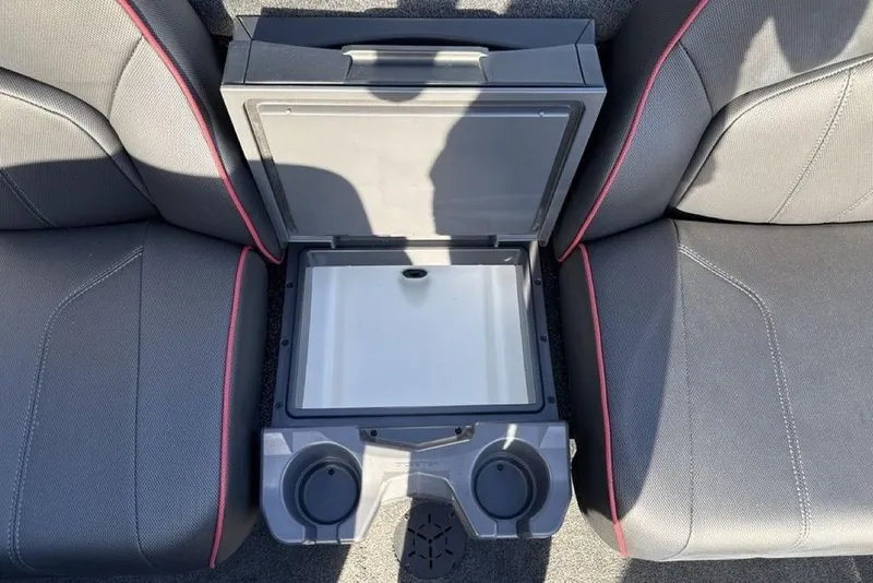 Slide: The Image of Interior of 2026 Skeeter ZX200 boat with open storage compartment and cup holders. - 12