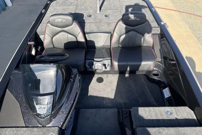 Slide: The Image of 2026 Skeeter ZX200 boat interior with dual seats and steering console. - 14