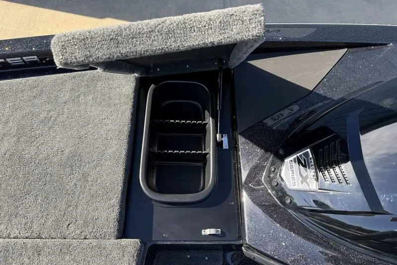 Slide: The Image of 2026 Skeeter ZX200 boat deck with storage compartment and engine detail. - 15