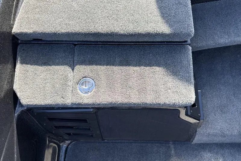 Slide: The Image of Carpeted storage compartment in 2026 Skeeter ZX200 boat interior. - 16