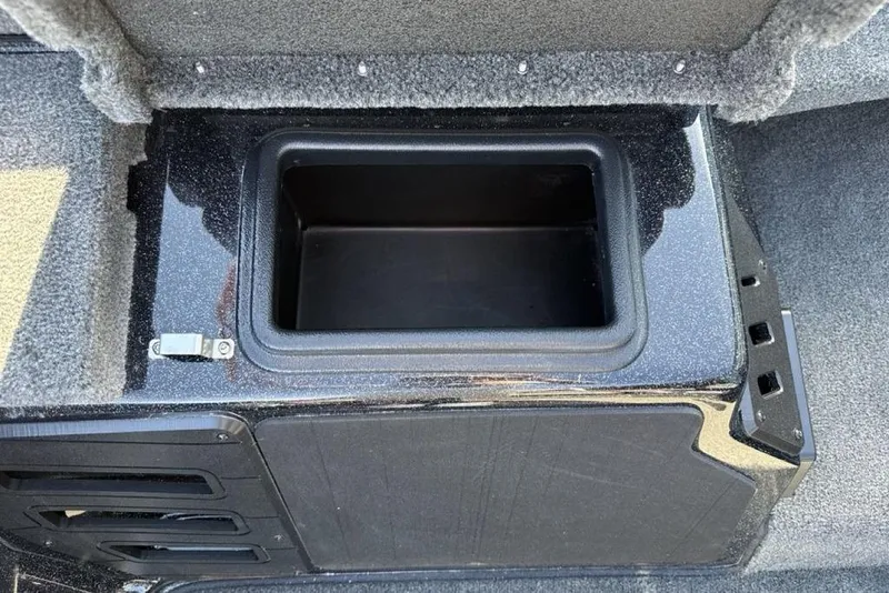 Slide: The Image of Storage compartment in 2026 Skeeter ZX200 boat, featuring sleek black interior design. - 17