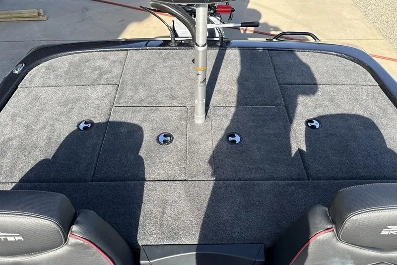 Slide: The Image of 2026 Skeeter ZX200 boat deck with carpeted surface and storage compartments. - 20