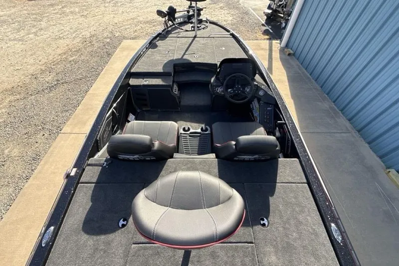 Slide: The Image of 2026 Skeeter ZX200 boat interior with seating and steering console. - 23