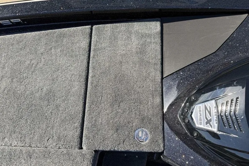 Slide: The Image of 2026 Skeeter ZX200 boat deck with textured surface and ZX Series emblem. - 25