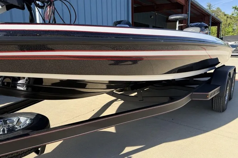 Slide: The Image of 2026 Skeeter ZX200 boat on trailer, sleek design with red and white accents. - 3