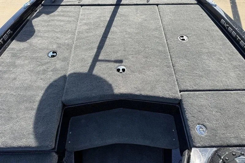 Slide: The Image of 2026 Skeeter ZX200 boat deck with gray carpet and storage compartments. - 5