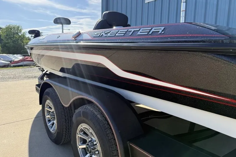 Slide: The Image of 2026 Skeeter ZX200 boat on trailer, sleek design, parked outdoors. - 6