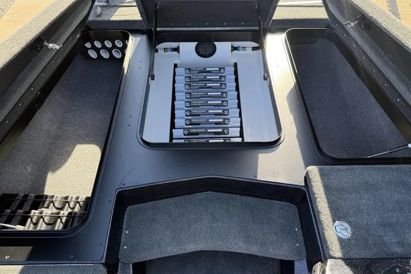 Slide: The Image of 2026 Skeeter ZX200 boat storage compartments with organized battery setup. - 8