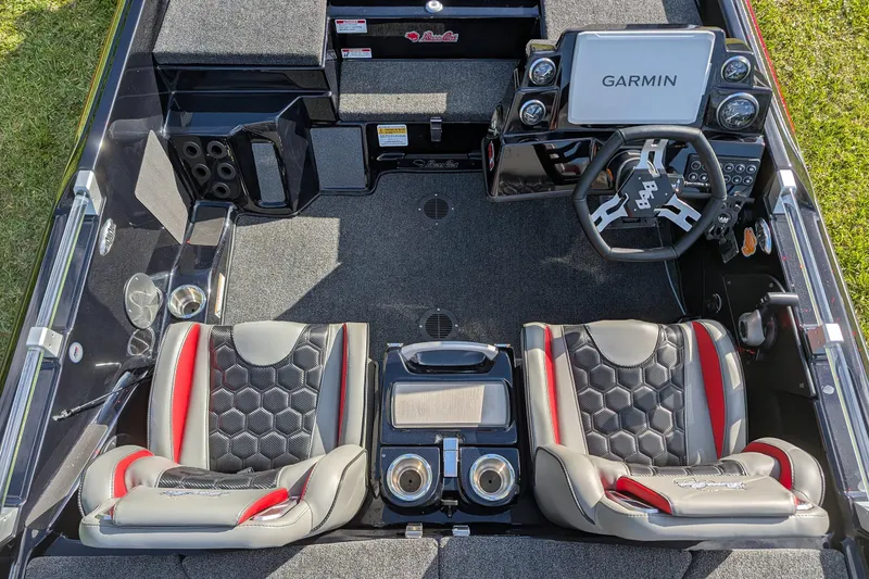 Slide: The Image of 2026 Bass Cat Cougar FTD boat interior with Garmin display and stylish seating. - 12
