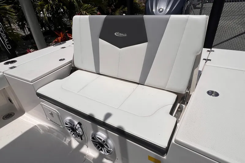 Slide: The Image of 2022 Robalo 246 Cayman boat seat with integrated speakers and storage compartments. - 14