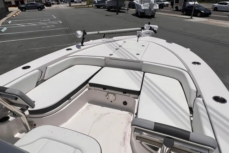 Slide: The Image of 2022 Robalo 246 Cayman boat interior with spacious seating and modern design. - 5