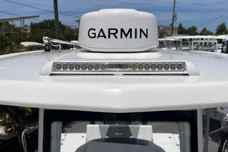 Slide: The Image of 2022 Robalo 246 Cayman boat with Garmin radar and LED light bar on the roof. - 9