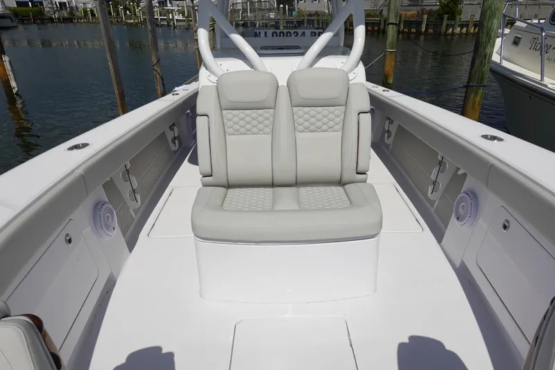 Slide: The Image of 2026 Jupiter 32 FS boat interior with cushioned seating and sleek design. - 13