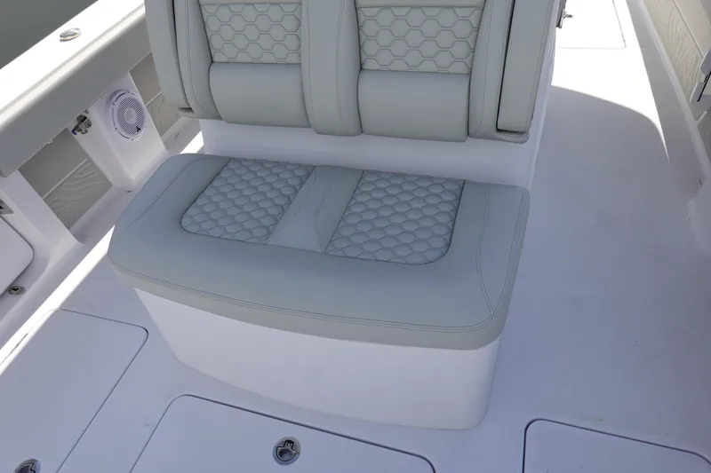 Slide: The Image of Luxury seating on 2026 Jupiter 32 FS boat with hexagonal pattern upholstery. - 15
