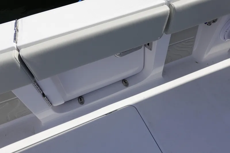 Slide: The Image of Interior view of a 2026 Jupiter 32 FS boat, featuring cushioned seating and sleek design. - 8