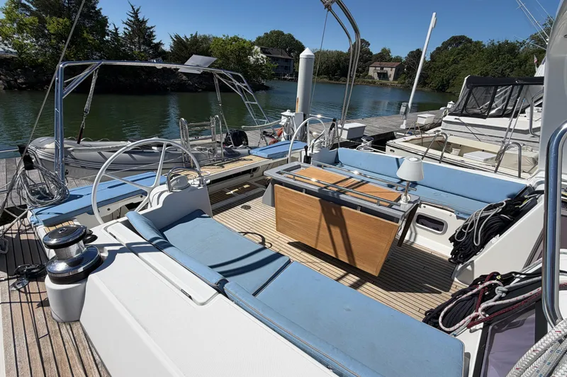 Slide: The Image of Spacious deck of 2016 Beneteau Oceanis 48 yacht, featuring comfortable seating and elegant design. - 13
