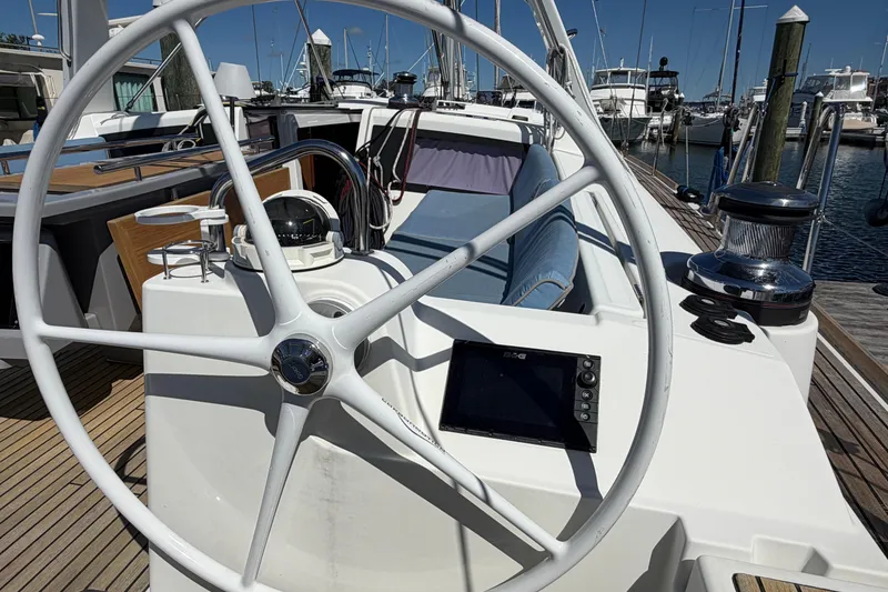 Slide: The Image of Steering wheel of a 2016 Beneteau Oceanis 48 yacht at a marina. - 17
