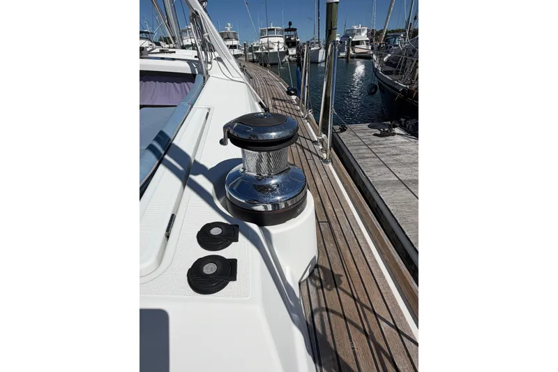 Slide: The Image of 2016 Beneteau Oceanis 48 yacht deck with winch, docked at marina. - 18