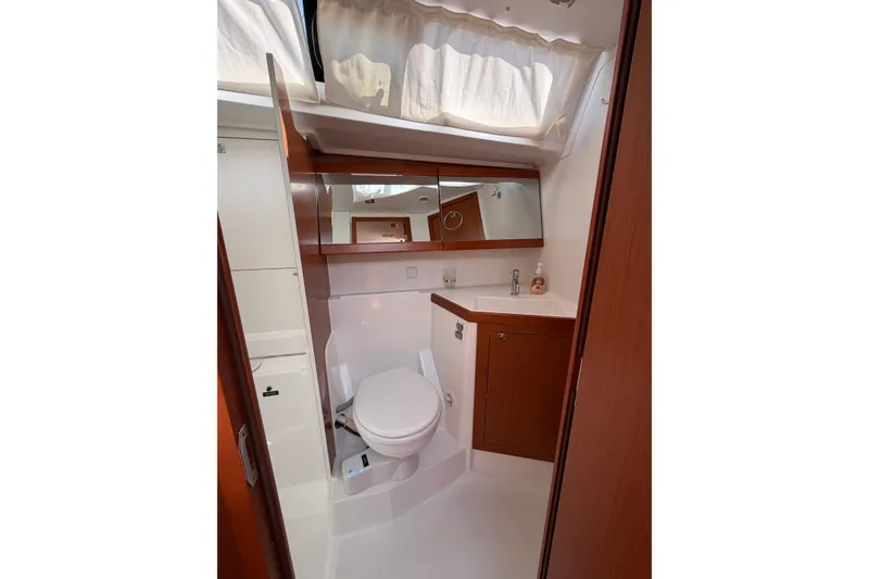 Slide: The Image of Bathroom interior of 2016 Beneteau Oceanis 48 yacht, featuring modern fixtures and wood accents. - 27